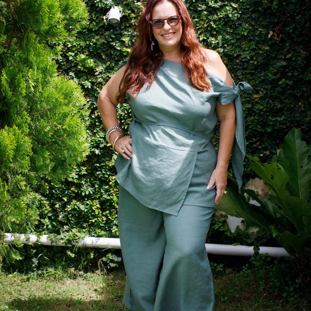 Linen one shoulder top in sage on curvy model