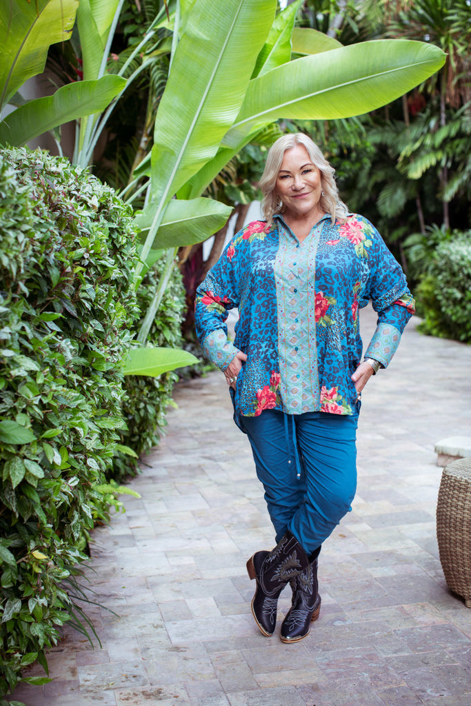 Taleeta - Blue Hibiscus Jungle Blouse - Blue Cotton Pants - Facing Front - Cross Legs - Fullshot