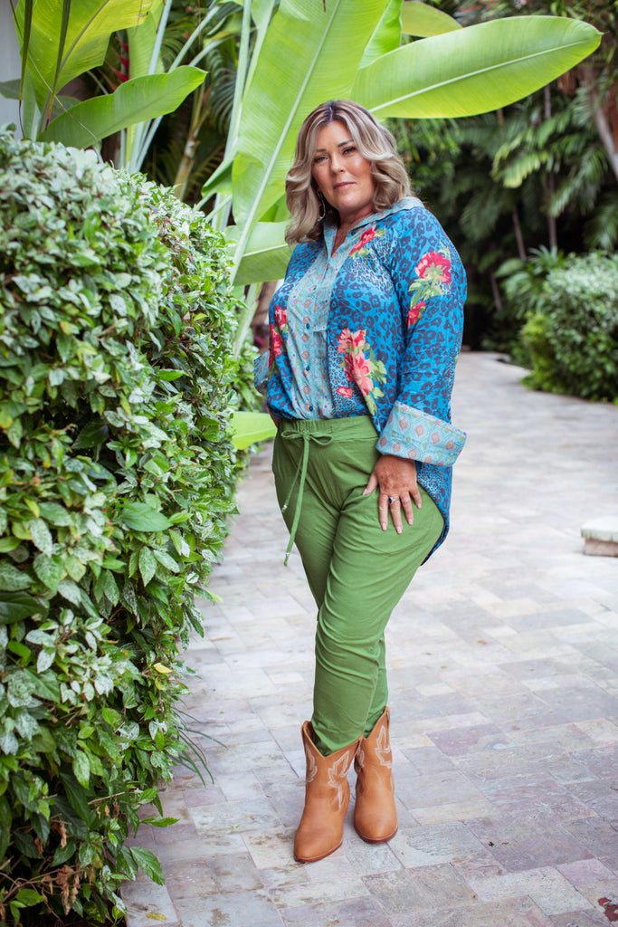 Taleeta - Blue Hibiscus Jungle Blouse - Leaf Cotton Pants - Facing Front Left - Cross Legs - Fullshot