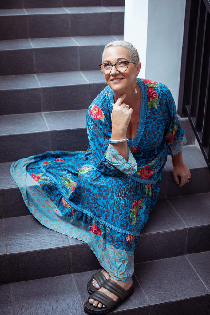 Taleeta - Blue Hibiscus Jungle Dress - Facing Front Left - Sitting - Fullshot