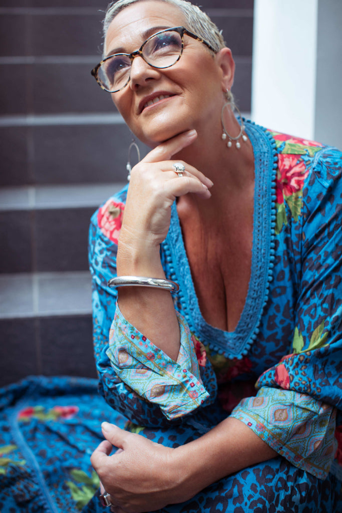 Taleeta - Blue Hibiscus Jungle Dress - Facing Front Left - Medium Closeup Shot