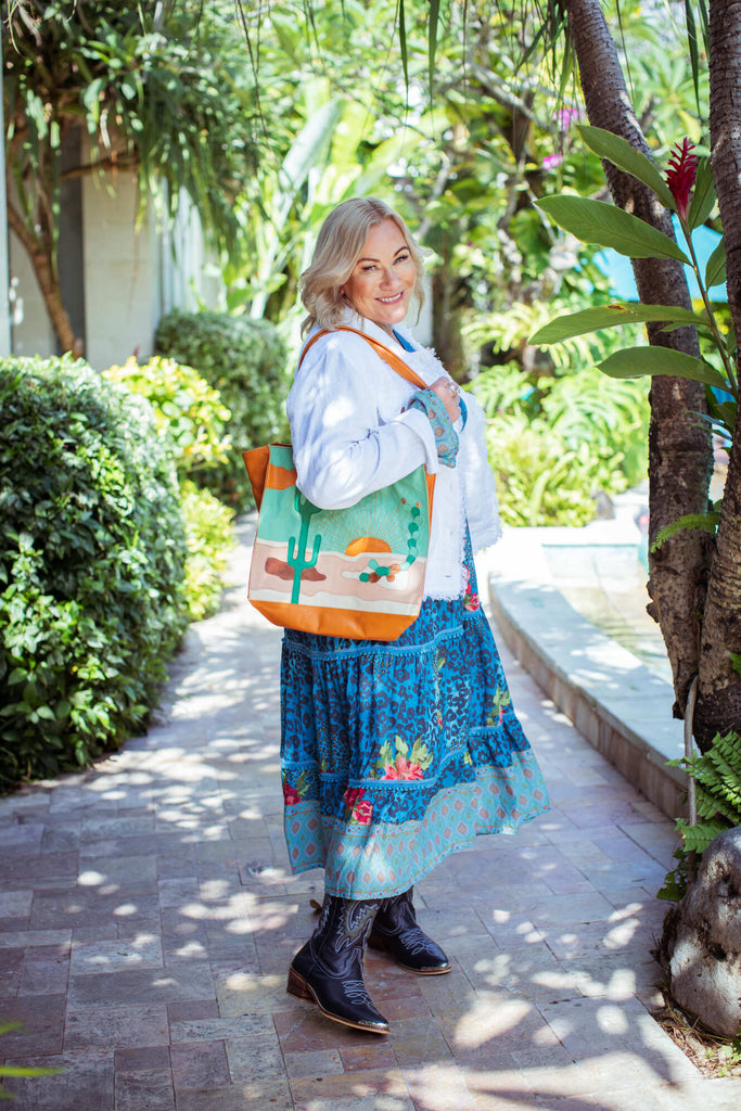 Taleeta - Blue Hibiscus Jungle Dress - White Jacket & Leather Bag - Facing Right Side - Fullshot