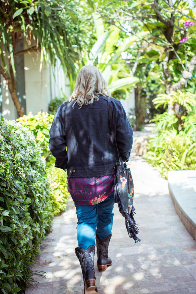 Taleeta - Indigo Jacket - Purple Hibiscus Jungle Blouse & Blue Cotton Pants & Leather Bag - Facing Backward - Fullshot