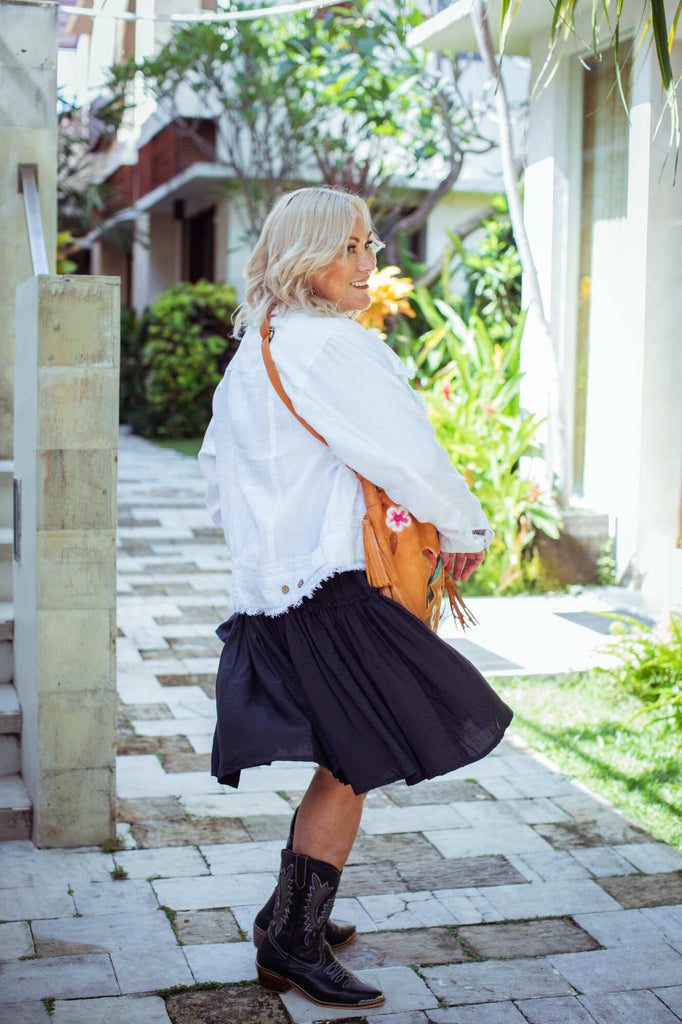 Taleeta - White Jacket - Indigo Dress & Leather Bag - Facing Right Side - Fullshot