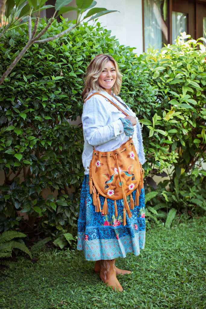 Taleeta - White Jacket - Blue Hibiscus Jungle Dress & Leather Bag - Facing Right Side - Fullshot