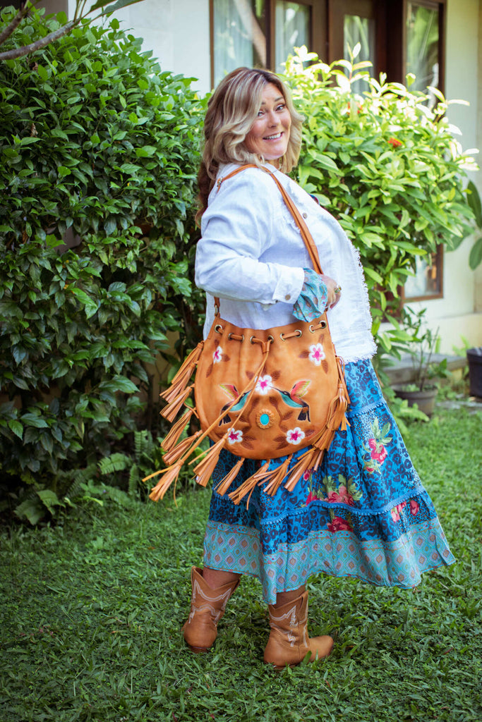 Taleeta - White Jacket - Blue Hibiscus Jungle Dress & Leather Bag - Facing Back Right - Fullshot